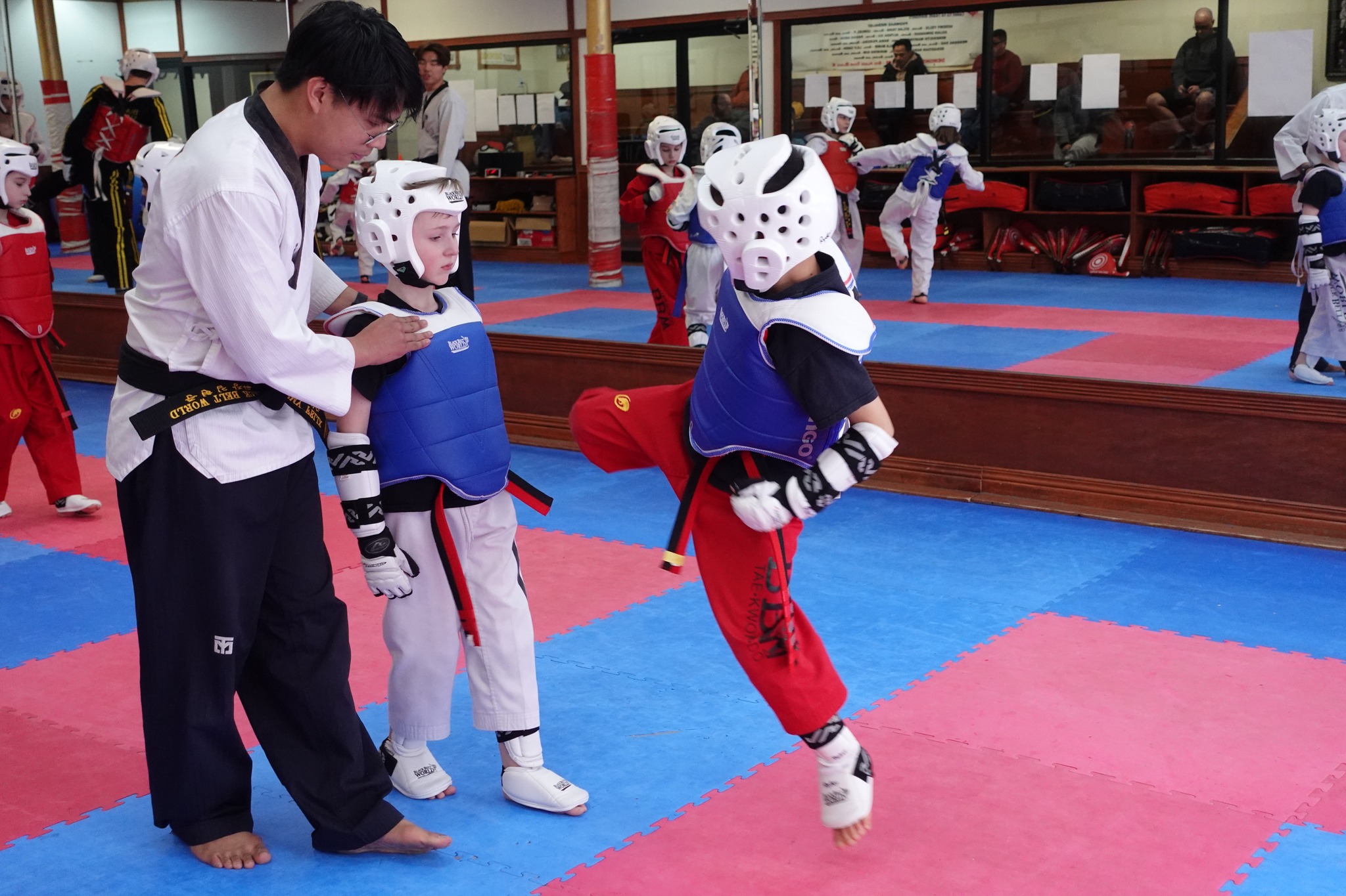 Young students practicing Taekwondo with enthusiasm